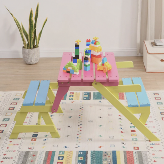 Colorful children's play table with blocks on a patterned rug