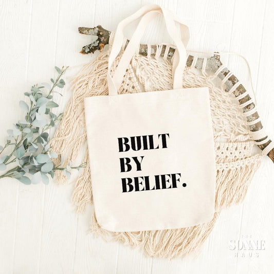 Motivational Cotton Canvas Tote Bag - BUILT BY BELIEF, Reusable Grocery Bag, Eco-Friendly Shopping Tote, Inspirational Gift, Everyday Carry - The Sonne Haus